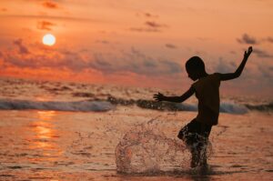 kid playing on the beach