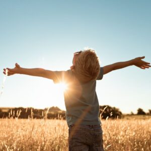 child looking at sky