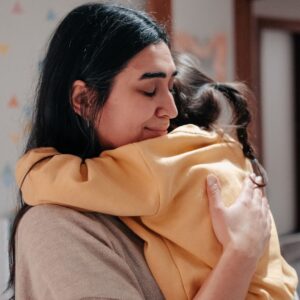 mom hugging child