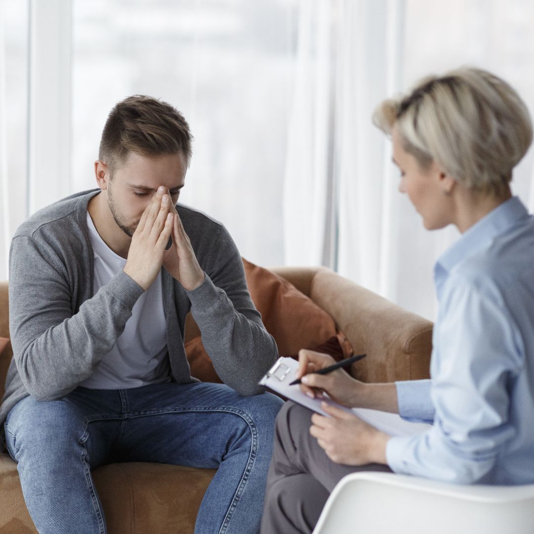 a man speaking to a counselor