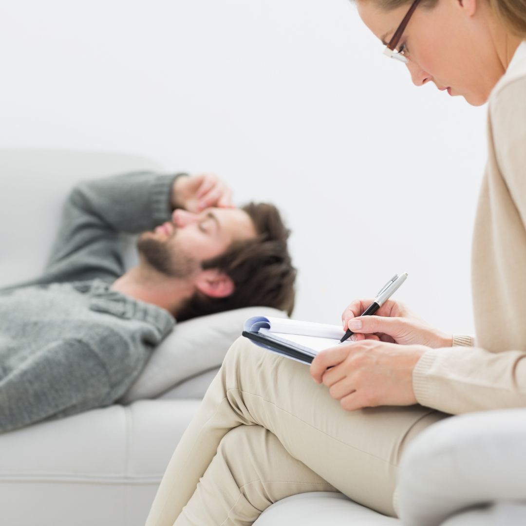 a counselor taking notes