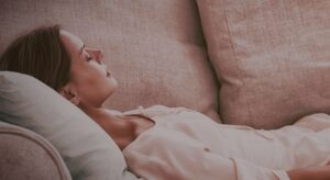 a woman laying on a therapy couch
