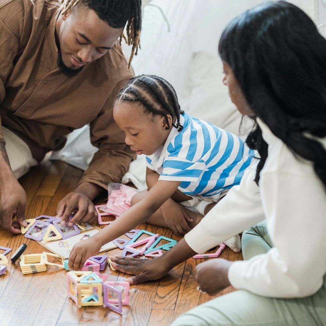 family playing with magnetic toy